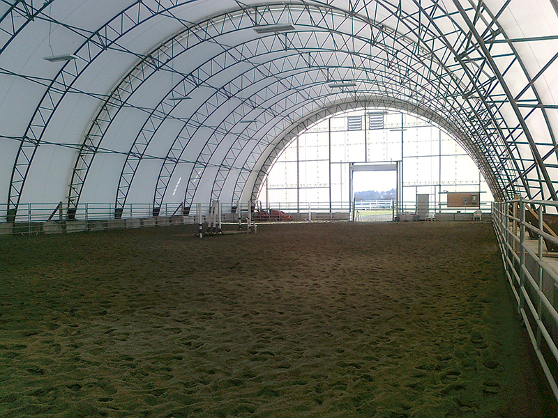 horse riding arena, indoor horse riding arenas, building horse riding arena, we cover, dutchmasters, ironwood building systems, fabric covered horse riding arena, wood post frame horse riding arena, lindsay day remt, steel frame horse riding arena, pre-engineered horse riding arenas, pre-built horse riding arenas, horse arena footing, pdi lasergrade, horse riding arena permit